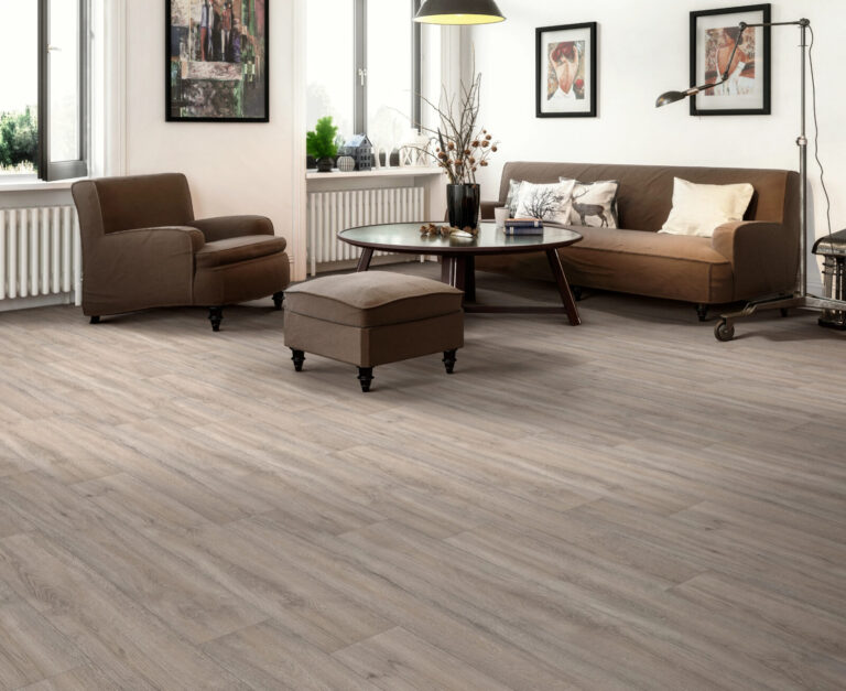 Living room with brown couches and a light brown luxury vinyl plank flooring.